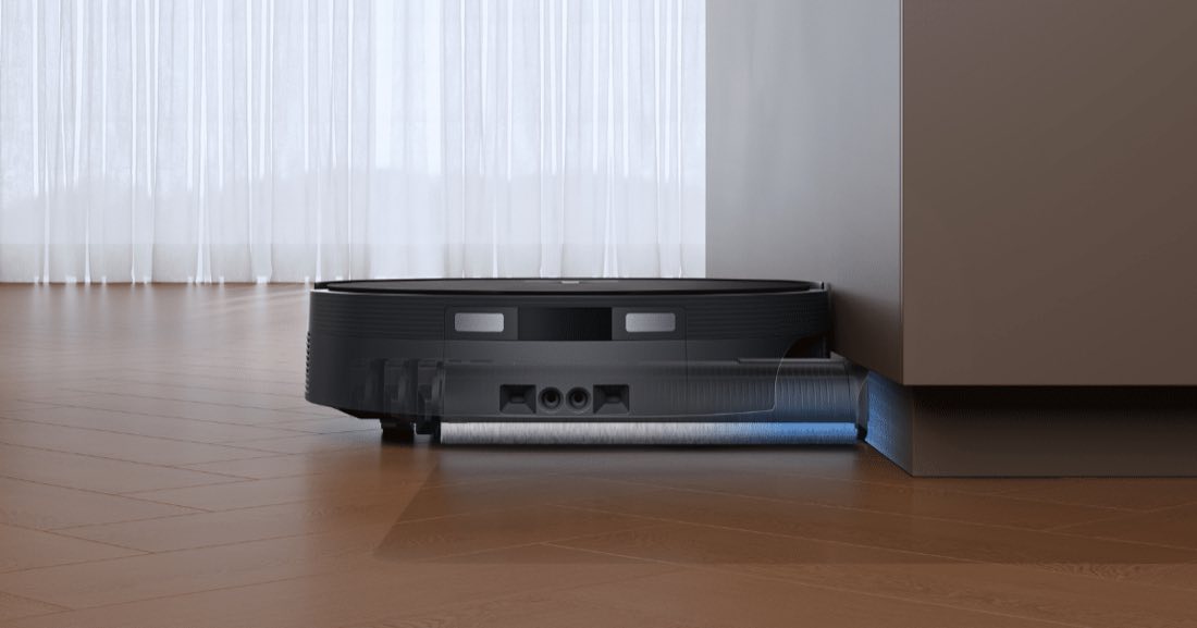 Ecovacs Deebot T90 Pro Omni underside showing the OZMO Roller 3.0 mop cleaning under furniture