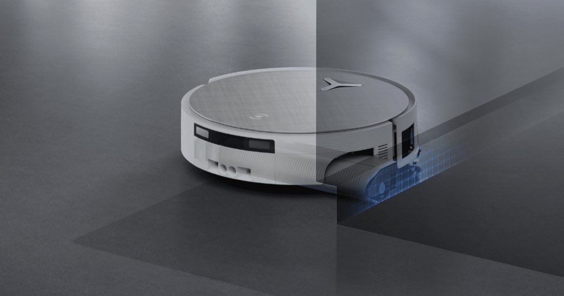 White Ecovacs Deebot T90 Pro Omni performing TruEdge deep edge cleaning along a wall